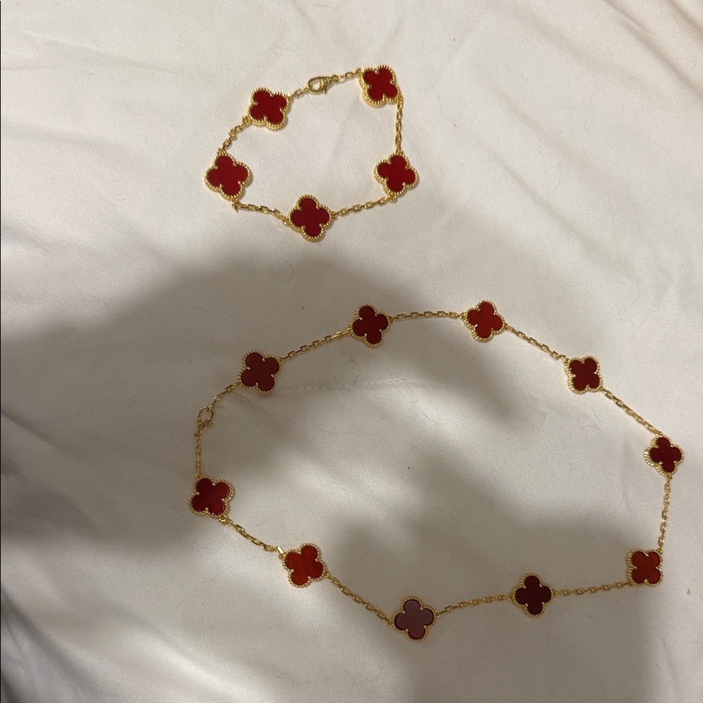 Elegant Red and Gold Clover Necklace and Bracelet Set